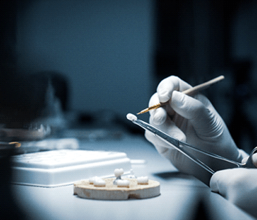 Dental technician working on a dental crown in Fort Worth