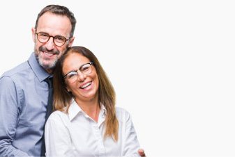 Smiling older man and woman holding each other