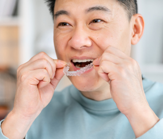 Patient in Fort Worth talking to dentist about Invisalign
