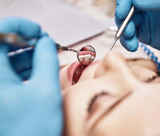 a patient receiving a dental checkup