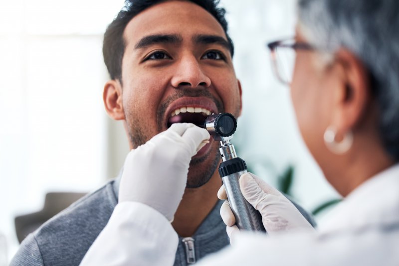man undergoing an oral cancer screening