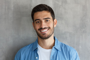 Man showing off smile with straight teeth